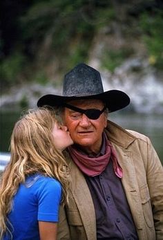 John Wayne and his daughter, Marissa, during a break from filming.    Famous People  multicityworldtravel.com We cover the world over 220 countries, 26 languages and 120 currencies Hotel and Flight deals.guarantee the best price Famous Cowboys, Rooster Cogburn, Lena Olin, Jenifer Aniston, Wilde Westen