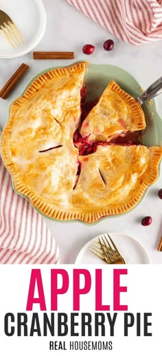 an apple cranberry pie on a plate with a slice taken out of it