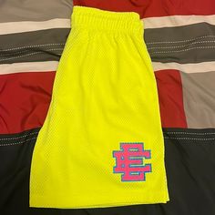 Brand New Casual Yellow Bermuda Shorts, Neon Yellow Sports Shorts For Summer, Yellow Sports Shorts For Summer, Yellow Bermuda Shorts For Summer, Neon Yellow Sports Shorts, Sporty Yellow Athletic Shorts With Short Leg, Yellow Athletic Shorts With Built-in Shorts For Spring, Yellow Sports Shorts For Spring, Yellow Athletic Shorts For Summer