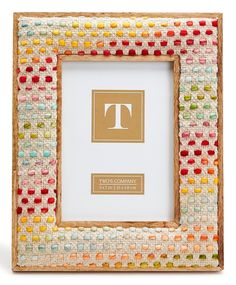 a colorful frame with the letter t on it's front and bottom, made out of woven material