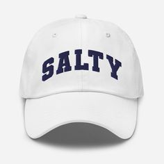 a white hat with the word salty on it in blue letters, against a white background