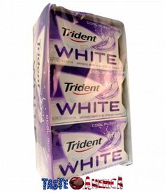 three packs of white toothpaste sitting on top of each other