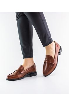 Hand-stitched detailing heightens the everyday refinement of a comfortable, cushy and arch-supporting loafer. 1" heel Cushioned footbed with arch support and gel heel insert Leather upper and lining/rubber sole Brown Cushioned Loafers For Business Casual, Brown Business Casual Loafers With Removable Insole, Cognac Round Toe Loafers For Business, Business Cognac Round Toe Loafers, Business Casual Brown Moccasins With Cushioned Footbed, Business Casual Loafers With Cushioned Footbed And Almond Toe, Brown Moccasins With Cushioned Footbed For Business Casual, Brown Cushioned Moccasins For Business Casual, Workwear Moccasins With Cushioned Footbed