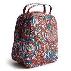 a brown and blue floral print backpack on a white background