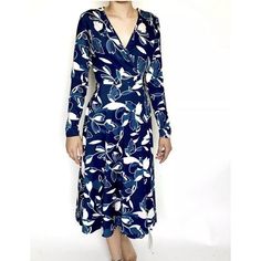 This Beautiful Yumi Kim Dress Is Perfect For Any Occasion, Whether It's A Formal Event Or A Casual Day Out. The Dress Features A Stunning Floral Pattern In Shades Of Navy Blue, With A V-Neckline And Long Sleeves. The Wrap Dress Style Adds A Touch Of Elegance, While The Tie Closure Ensures A Perfect Fit. New Measurements Laying Flat Pit To Pit 18" Length 44" Shades Of Navy Blue, Wrap Dress Styles, Kim Dress, Yumi Kim, Formal Event, Blue Floral, Wrap Dress, Floral Pattern, The Dress