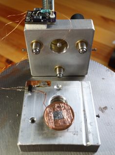 an electronic device sitting on top of a metal table