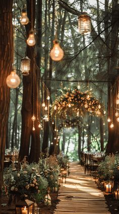 an outdoor wedding venue with lanterns hanging from the trees