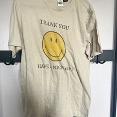 Smiley Face Tee Beige Crew Neck T-shirt With Screen Print, Beige Crew Neck T-shirt With Letter Print, Retro Beige Short Sleeve T-shirt, Retro Yellow Slogan Tops, Retro Yellow Tops With Slogan, Retro Yellow T-shirt With Slogan, Casual Beige T-shirt With Letter Print, Basic Yellow Relaxed Fit T-shirt, Yellow Basic Relaxed Fit T-shirt