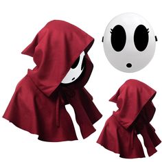 a red cape and hood with eyes on it, next to a white ball that looks like a ghost