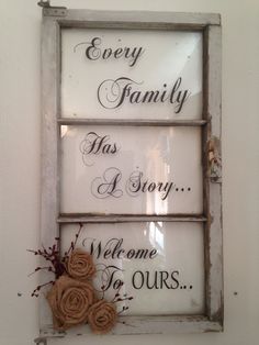 an old window with some flowers in it and the words every family has a story