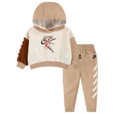 Swaddle up your little bundles of joy in the cozy charm of the Nike Fleece Hoodie Set. Supersoft and fuzzy on the inside, this oh-so-comfy set ensures top-to-bottom snugness—making it a perfect ensemble for your baby boys. The hooded top is cut in a loose fit to keep your kiddos cheerfully wiggly, while the joggers are completed with a soft, elastic waistband and pull-on design. Sporting a Nike graphic design on the top and Nike logo at the leg, the Nike Fleece Hoodie Set adds the magic of Swoos Nike Graphic Design, Nike Fleece Hoodie, Estilo Swag, Tapered Joggers, Comfy Sets, Nike Fleece, Hoodie Set, Hooded Top, Comfy Pants