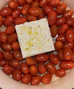 tomatoes and cheese in a bowl with water