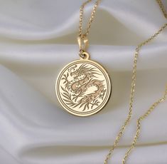 🐉 Step into the enchanting realm of Chinese New Year with our mesmerizing dragon necklace! 🎉 Crafted with meticulous attention to detail, this exquisite piece is a vibrant celebration of tradition, strength, and auspicious beginnings. Imagine the majestic dragon, intricately designed with shimmering scales ✨ and fierce claws, symbolizing power and resilience. With each wear, you'll embody the spirit of this mythical creature, carrying with you the energy of the Lunar New Year. 🌟 * Gender : Male / Female * Material Options : Silver, Gold Plated, Rose Gold, 14K Solid Gold * Thickness of Silver Pendant: 1.0 mm * Thickness of Gold Pendant: 0.8 mm * The Gold Plated and The Rose Gold Plated options are applied to 925 Sterling Silver with solution that contains 14K Gold. * There are several op Majestic Dragon, Mythical Dragons, Dragon Necklace, Mythical Creature, Crafts Jewelry, Dragon Pendant, Lunar New Year, Chinese Traditional, Diy Crafts Jewelry