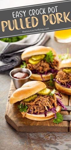 three pulled pork sandwiches on a cutting board