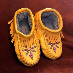 On offer is a beautiful pair of Ladies size 7 Tan Buffalo Hide leather 'Starburst' design moccasins with handmade bead work from the Manitoba first nations artist Night Eagle. 100% leather with embroidered bead work. These moccasins will stretch a little once worn. No return policy on the moccasins! If you want to see more of my items, google (The Kanata Shop) NOTE: APPLIES TO ALL BUYERS  Look At all Picture's Closely, What You See Is What You Will Receive, I Do My Best To Get You The Best View Of The Item.  (PLEASE ASK ALL AND ANY QUESTIONS?)  LOOK AND READ EVERYTHING BEFORE YOU PURCHASE Shipping & Handling, Materials And Expenses Will Be Included In Shipping Fee All border / customs fee's and or taxes are solely the responsibility of the buyer. If you are satisfied with your purchase ple Hand-stitched Leather Moccasins With Round Toe, Hand-stitched Leather Moccasins With Closed Toe, Leather Hand-stitched Closed Toe Moccasins, Yellow Moccasins With Rubber Sole And Round Toe, Yellow Slip-on Moccasins With Rubber Sole, Yellow Round Toe Moccasins With Rubber Sole, Festival Moccasins With Soft Sole And Round Toe, Western Style Closed Toe Moccasins With Rubber Sole, Artisan Hand-stitched Round Toe Moccasins