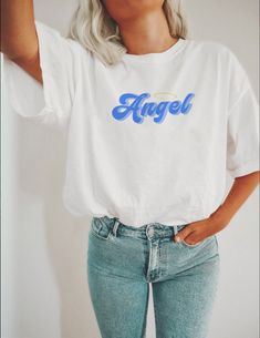 ** Regular length tee; can be knotted to the front, the side, or in the back for a more snug and shorter fit. Tee can also be cut into a crop top! Our T-Shirts are a UNISEX FIT, if you would like a tighter fit please consider SIZING DOWN. We recommend the looser fit as that's how it's meant to worn, but we're all rebels here so do as you please :) **T Shirt Size Guide (in inches) SMLXL2XL Full Body Length282930 31 32 Sleeve Length 15 ⅝ 1718 ½ 20 21 ½ Body Width 18 20 22 24 26 Body Length 28 29 3 2000s Shirts, Clothing Preppy, Dental Assistant Shirts, Shirts Y2k, Dental Assistant Gifts, Dental Hygienist Gifts, 2000s Clothing, Dental Gifts, Angel Shirt