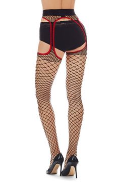 A modern take on the classic fishnet, these suspender tights feature bold cutouts for an alluring look. Nylon/spandex Hand wash, dry flat Imported Black Fishnet Mesh Legwear, Edgy Stretch Hosiery For Night Out, Black Fishnet Mesh Tights, Black Fishnet Bottoms, Stretch Fishnet Bottoms, Black Fishnet Thigh High Legwear, Black Fishnet Thigh-high Legwear, Black Mesh Thigh High Legwear, Black Mesh Thigh-high Legwear