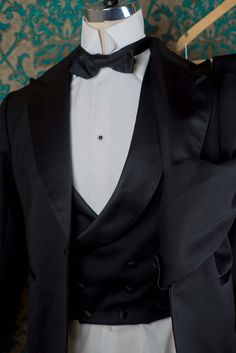 "The pricing on this listing is for a 3pc Handsewn Tux with the muslin fitting. We can make a similar tux in our Decadence '89 style with less handwork for a lower price. 1909 BESPOKE: These are our completely custom handmade suits. Each suit is crafted for an individual customer based on his tastes and lifestyle, and the price of the suit includes us spending 4 hours on designing your suit alone and sketching ideas. These suits are completely patterned, cut, and sewn here in our studio in Denve Bespoke Fitted Evening Suits, Bespoke Fitted Tuxedo For Black-tie Events, Black Tuxedo With Shawl Collar For Wedding, Bespoke Fitted Tuxedo For Formal Occasions, Black Shawl Collar Tuxedo For Wedding, Black Silk Tuxedo With Pressed Crease, Fitted Silk Suit For Black-tie Events, Timeless Fitted Tuxedo For Evening, Luxury Fitted Three-piece Suit With Suit Collar