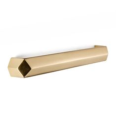 a gold door handle on a white wall