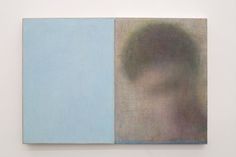 an abstract painting with blue and grey colors on the wall next to it is a man's head