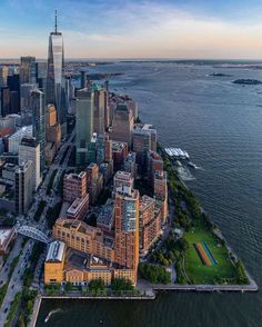 an aerial view of the city and water