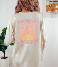 Soakin' Up Sunshine, retro aesthetic groovy t-shirt for summer or your beach vacation. Makes a perfect swimsuit cover up for boating or playing in the sand. Choose your size and color option at checkout. I'll have your shirt produced and delivered in about a week. Printed on a TOP QUALITY, 100% garment dyed, sustainably sourced cotton Comfort Colors Tee If you don't already own one of these shirts, you're in for a treat! Super Soft, Relaxed Unisex Fit Size up a size or two for an over-sized fit. Cheap Groovy Summer T-shirt, Beach T Shirt, 60s Retro, Print Design Pattern, Perfect Swimsuit, Beach T Shirts, Comfort Colors Tee, Vacation Shirts, T Shirt Oversized