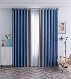 a living room with blue and grey curtains