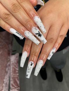 a woman with white nail polish holding her hands out to show off her manies