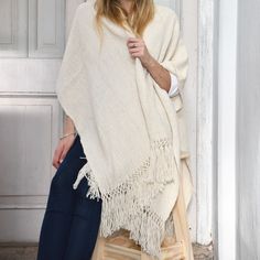 Soft and warm, the original Argentinian Shawl poncho was used by gauchos to keep their bodies warm and dry in cold and rainy weather. Enjoy great quality and tradition! Our ponchos are made of llama wool. Each piece is one of a kind and sustainably made, in line with the highest environmental standards . Wide weaving, llama wool and cotton combination. This poncho comes in three different colors: brown, white and black. They have a finishing fringe. Length: 82cm/32.3" Width: 110cm/43.3" Knitted Shawl, Rainy Weather, Colors Brown, Body Warmer, Knitted Shawls, Llama, Shawl, White And Black, Wool