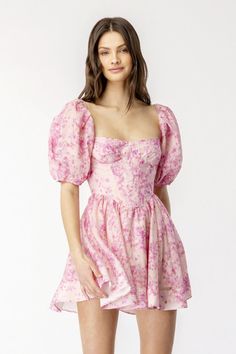 There’s more than a dash of old-time romance in the Tudor neckline, puffed sleeves and corset-style bodice of this mini-dress, but the sweet blossom print in shades of pink keeps it firmly in the present. The short, swingy skirt and wide, scooped back add to its charm. Self: 40% ramie, 30% lyocell, 30% cotton Lining: 100% cotton Made in China Hand wash Fully lined Exposed back zipper closure Boned bodice Puff sleeves with cinched cuffs Lightweight linen fabric with ruffle hem Dresses Tight, Corset Mini Dress, Dresses Pink, Dress 16, Hoco Dresses, Crop Top Blouse, Corset Style, Boho Maxi Dress, Puffed Sleeves