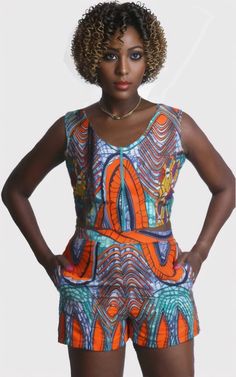 Stylish Summer Outfit: The Ankara shorts crop top set is a trendy and vibrant choice for the warmer months. The bold and colorful Ankara fabric adds a unique touch to the ensemble, perfect for standing out at summer events. The matching set also takes the guesswork out of styling, making it a convenient and fashionable option for any casual or semi-formal occasion. Akara Traditional Shorts, Ankara Shorts, Ankara Crop Top, African Clothing Stores, Shorts Crop Top, Crop Top Shorts, Skirt Top Set, Summer Tank Top, Shorts Sets