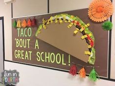 a bulletin board with taco decorations on it and the words taco about a great school