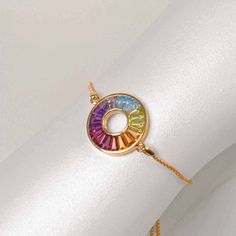 Introducing our Multicolor Rainbow Circle Bolo Bracelet – a vibrant celebration of uniqueness. This elegant piece features a captivating circle adorned with meticulously arranged gemstones, creating a mesmerizing spectrum of hues that dance with every movement. Rainbow Circle, Bolo Bracelet, Vibrant Style, Circle Of Life, 18k Gold, Rainbow, Bracelet, Gemstones, Gold