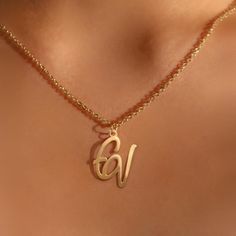 Personalize Your Style with Our Logo Name Necklace. Crafted with precision and attention to detail, this necklace is the perfect way to showcase your personal style. Metal: Stainless Steel Available in a variety of finishes: 🌹 Rose Gold 🟡 18k Gold 🥈 Silver The chain length options include: - 16" - 18" - 20" - 22" Each necklace is meticulously: ✨ Designed ✨ Polished ✨ Assembled Please note: All our items come with a 5 cm/2" extension chain. so don't hesitate about the size!! * 14" NECKLACE: Fits most like a choker * 16" NECKLACE: Falls perfectly around the base of the neck like a collar. On a petite woman it will hit your collarbone while for plus size women it might feel more like a choker. * 18" NECKLACE: A common choice for women that will fall just below the throat at the collarbone. Trendy Gold Initial Necklace For Personalized Gift, Gold Initial Necklace With Adjustable Chain For Mother's Day, Trendy Personalized Gold Initial Necklace, Gold Initial Necklace With Delicate Chain For Personalized Gift, Gold Monogram Necklace In Trendy Style, Trendy Gold Monogram Necklace, Gold Necklace With Delicate Chain For Personalized Gift, Trendy Gold Initial Pendant Name Necklace, Gold Monogram Charm Necklaces For Mother's Day