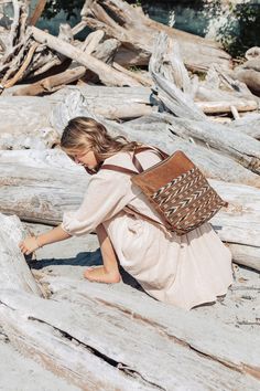 "Canadian coastal ruggedness comes together with an old world storyteller in our signature Tofino Backpack in its latest incarnation. Made from durable & water resistant waxed canvas and featuring a one of a kind vintage ikat printed front inset that doubles as a front pocket, the Tofino backpack comes complete with leather adjustable straps, zipper closure and inner pocket. * Made from American made water resistant tan waxed canvas * Featuring front ikat pocket in 'Desert Painted' print  * Brown cowhide adjustable backpack straps with brass fittings * Thick natural off-white canvas lining with one inner pocket * Measures 14\" across x 12\" in height to 3\" gusset * Brass YKK metal zipper and leather zipper pull * Handle on top with a 3\" drop Grace Design Textiles ethically sourced worldw Leather And Canvas Bags, Artisan Brown Backpack For Travel, Artisan Backpack For Travel, Bohemian Brown Backpack For Everyday, Artisan Rectangular Backpack For Everyday Use, Artisan Travel Backpack, Bohemian Style Brown Backpack, Bohemian Brown Standard Backpack, Everyday Brown Bohemian Backpack