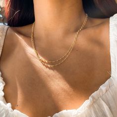 D E T A I L S • Single Beaded Chain• 18k Gold Filled• Length: 20" M A T E R I A L S •Our Gold filled jewelry has an outer layer of 14k or 18k gold that is pressure bonded to a base metal of jewelers brass or sterling silver. •This type of jewelry is made for everyday use of stacking or layering. • This type of jewelry can withstand normal body sweat, body oils, and is typically water resistant. J E W E L R Y C A R E Take extra care of your new jewelry to maximize its lifespan: •Try to avoid cont Dainty Beaded Chain Layered Necklace, Minimalist Beaded Chain Layered Necklace, Minimalist Everyday Beaded Chain Layered Necklace, Dainty Beaded Chain Necklaces For Layering, Dainty Beaded Chain Necklace For Layering, Dainty Double Strand Chain Necklace, Dainty Layered Necklace With Satellite Chain, Dainty Beaded Chain Charm Necklace For Everyday, Delicate Double Strand Layered Necklace With Satellite Chain