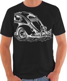 a man wearing a black t - shirt with an image of a car on it