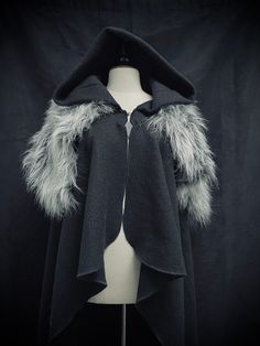 Cape made of 100% boiled wool with hood which closes with a hook (included) with the possibility of adding a crossed belt system to attach in a "combat cape" style allowing perfect freedom of movement This cape can be made in the color of your choice, for more information contact me ✨ It will be your ally for all your Larp events and celebrations of all kinds to keep you warm! The cape has a total height of approximately 135 cm (without hood) Gothic Outerwear For Fantasy Events In Winter, Gothic Winter Larp Outerwear, Medieval Outerwear For Winter Cosplay, Hooded Winter Cape For Cosplay, Hooded Cape For Cosplay In Winter, Winter Hooded Cape For Cosplay, Gothic Hooded Winter Cape, Medieval Costume Outerwear For Winter, Hooded Outerwear For Fantasy Events In Winter