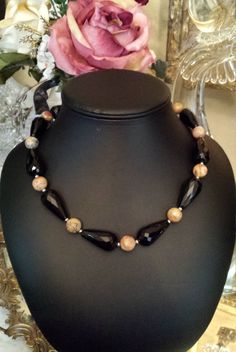 "One strand faceted black onyx and faceted crazy agate necklace. This necklace measures 20\" long. The black onyx tube faceted bead is 1 1/4\" long. The necklace and stones are beautiful. Looks great with any outfit. If you like it \" pin it \"." Black Agate Round Bead Necklaces, Black Onyx Round Bead Crystal Necklaces, Black Agate Bead Necklaces, Black Onyx Round Beads Crystal Necklace, Black Onyx Round Beads Necklace, Black Agate Bead Necklace, Black Onyx Beaded Necklace With Faceted Beads, Black Agate Necklace With Black Beads, Black Agate Beaded Necklace With Natural Stones