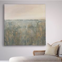 an abstract painting hangs on the wall above a couch in a room with white walls