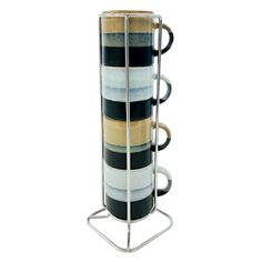 a stack of coffee mugs sitting on top of a metal stand with four cups in it