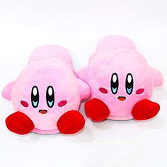 two pink stuffed toys with red feet on a white surface