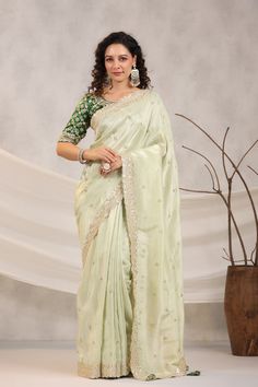 Shop beautiful pista green embroidered silk saree online in USA with embroidered designer blouse. Make a fashion statement on festive occasions and weddings with designer suits, Indian dresses, Anarkali suits, palazzo suits, designer sarees, sharara suits, Bollywood saris from Pure Elegance Indian fashion store in USA.-full view Designer Chanderi Pre-draped Saree In Pista Green, Eid Pista Green Dola Silk Pre-draped Saree, Green Chanderi Pre-draped Saree For Reception, Pista Green Chanderi Pre-draped Saree, Green Tissue Silk Saree For Reception, Pista Green Anarkali Style Pre-draped Chanderi Saree, Pista Green Raw Silk Pre-draped Saree For Diwali, Green Dola Silk Pre-draped Saree For Diwali, Pista Green Pre-draped Saree For Diwali Reception