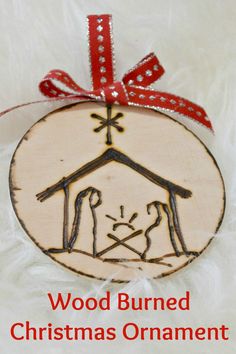 a wooden ornament with a christmas nativity scene on it's side