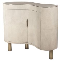 a white cabinet with two doors and metal legs