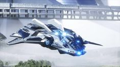 a futuristic vehicle flying through the air with bright lights on it's wings and wheels