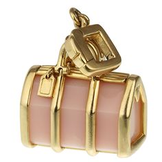 Experience the epitome of elegance and versatility with the Louis Vuitton Yellow Gold Rose Quartz Bag Charm. Crafted with exquisite attention to detail, this versatile piece can be worn as a pendant, or even added to a charm bracelet, showcasing its adaptable nature. The charm is meticulously designed from 18k yellow gold, known for its rich, luxurious sheen that radiates warmth. The lustrous yellow gold perfectly complements the mesmerizing tones of the rose quartz, creating a harmonious balanc Elegant Gold Bag With Logo Charm, Elegant Bag Charm With Logo, Luxury Bags With Logo Charm For Gift, Luxury Logo Bag Charm For Gift, Luxury Logo Bag Charm As Gift, Elegant Gold Bag Charm For Gift, Elegant Gold Bag Charm As Gift, Luxury Gold Bag Charm As Gift, Luxury Removable Charms For Gifts