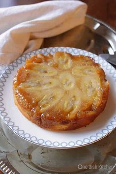 a cake on a plate with a knife and fork