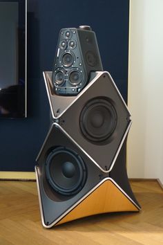 two speakers are stacked on top of each other