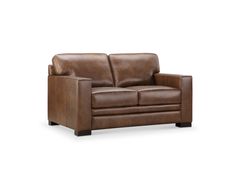 a brown leather couch sitting on top of a white floor